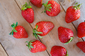 Fototapeta na wymiar Fresh red strawberries on wooden table