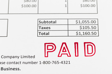 Invoice with paid stamp; document is mock-up