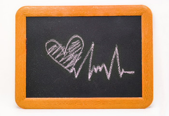 Heartbeat sign, love heart on a chalkboard
