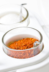 Cayenne pepper in container, Thai style seasoning pot.