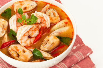 Tom Yum Kung - traditional thai spicy soup with shrimp and mushrooms