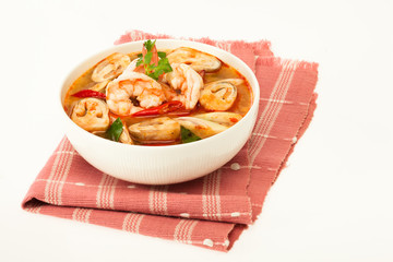 Tom Yum Kung - traditional thai spicy soup with shrimp and mushrooms