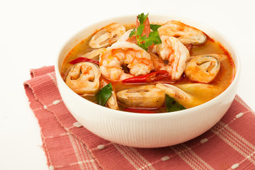 Tom Yum Kung - traditional thai spicy soup with shrimp and mushrooms