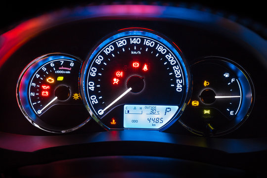 Modern car instrument dashboard panel  in night time