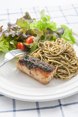 italian pasta spaghetti with pesto sauce and striped bass , Clos