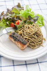 italian pasta spaghetti with pesto sauce and striped bass , Clos
