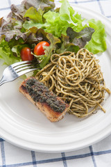 italian pasta spaghetti with pesto sauce and striped bass , Clos