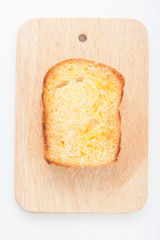 toasted bread with honey on wood table still life