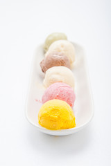 Mixed ice creams in bowl on white background