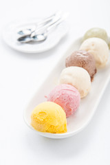 Mixed ice creams in bowl on white background
