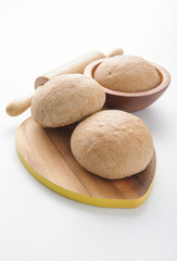 Wholewheat bread rolls on white background