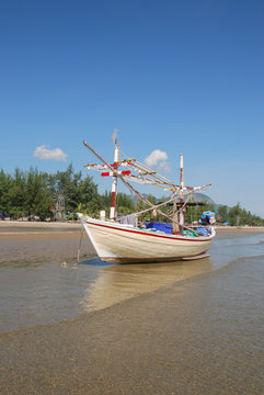 Small fishing boats on the beach in Phetchaburi