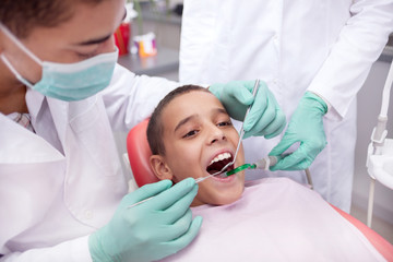 Little boy sitting in the dentists office