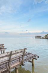 Wood terrace and Beach and tropical sea with blue sky