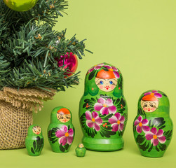 Russian wooden dolls around a Christmas tree
