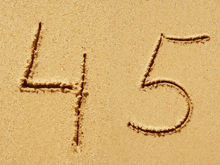 Sand font or number set or collection on an exotic beach near the sea in summer