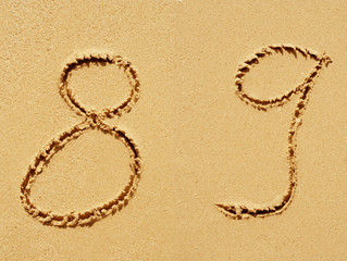 Sand font or number set or collection on an exotic beach near the sea in summer