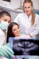 Fototapeta premium Dentist explaining the details of x-ray picture to his patient