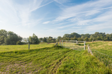 Closed iron gates in a rural area