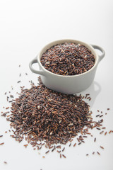 rice berry in cup on white background
