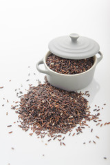 rice berry in cup on white background