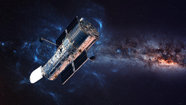 The Hubble Space Telescope in orbit above the Earth. Elements of this image furnished by NASA