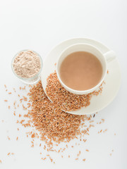 Rice milk in glass and rice crop isolated on white background. V