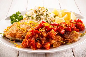 Fish dish - fried fish fillet white rice and vegetables 