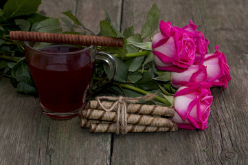 beautiful still life, tea, roses and linking of cookies