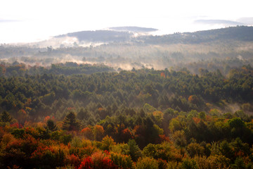 An aerial view of a hot air balloon floating over the Vermont country side ..