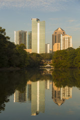 Fototapeta na wymiar Atlanta skyline with water reflections from Piedmont Park, USA