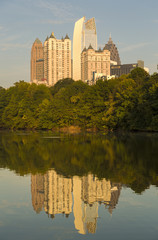 Fototapeta na wymiar Atlanta skyline with water reflections from Piedmont Park, USA