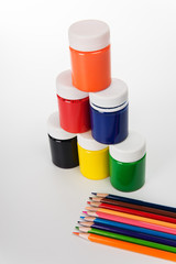 Set of colored pencils and paints for children's creativity