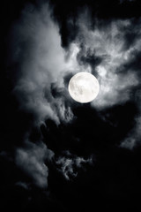 Naklejka na ściany i meble Dark cloudy sky with full moon