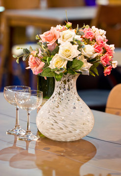 Table decor with flowers and empty glasses.