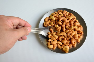 Cashews in spoon