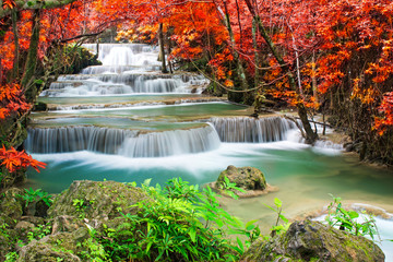 Amazing waterfall in autumn forest 