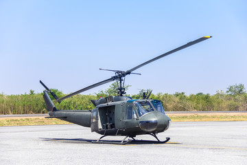 Fototapeta na wymiar Military helicopter (huey) at a base