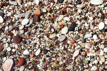 Wet pebble on a beach, selective focus
