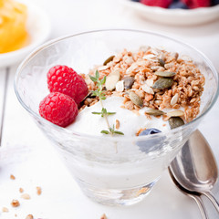 Healthy breakfast. Granola with pumpkin seeds, honey, yogurt, fresh berries .