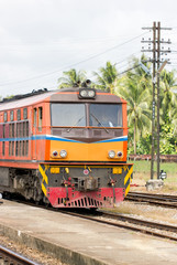 Fototapeta na wymiar Vintage train on track at station, Thailand.