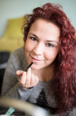 Woman makeup at home.