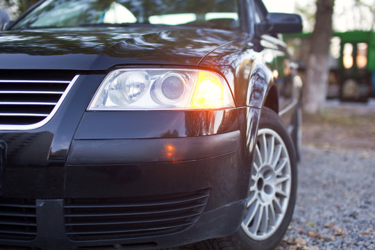 Headlights of the black car close-up photo