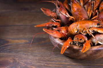  boiled crawfish at wooden background, vintage toned