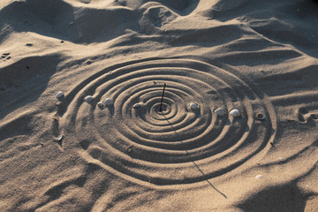 Conceptual sundial on the beach sand - 95318772