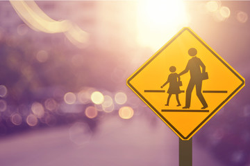 School sign.Traffic sign road on blur road abstract background.
