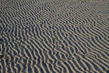 Patterns in the sand at the beach in thailand