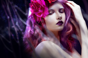 beautiful girl with pink hair,  among the branches