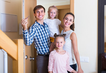 Fototapeta na wymiar family standing at doorway