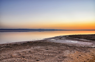 Fototapeta na wymiar Beautiful sunrise on salt lake Chott el Djerid, Sahara desert, T